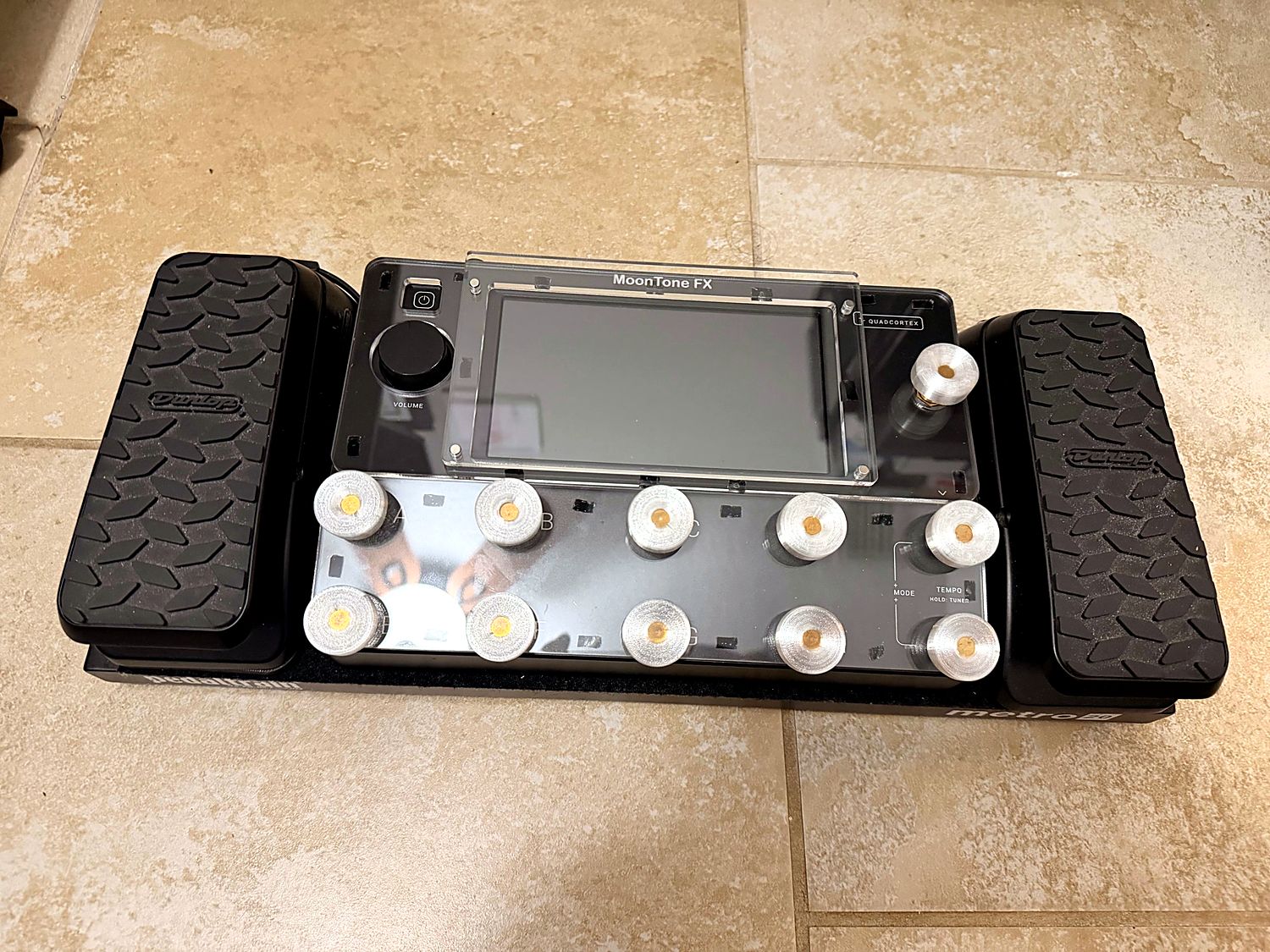 Quad Cortex on a pedalboard with custom acrylic cover and 3D-printed footswitch caps